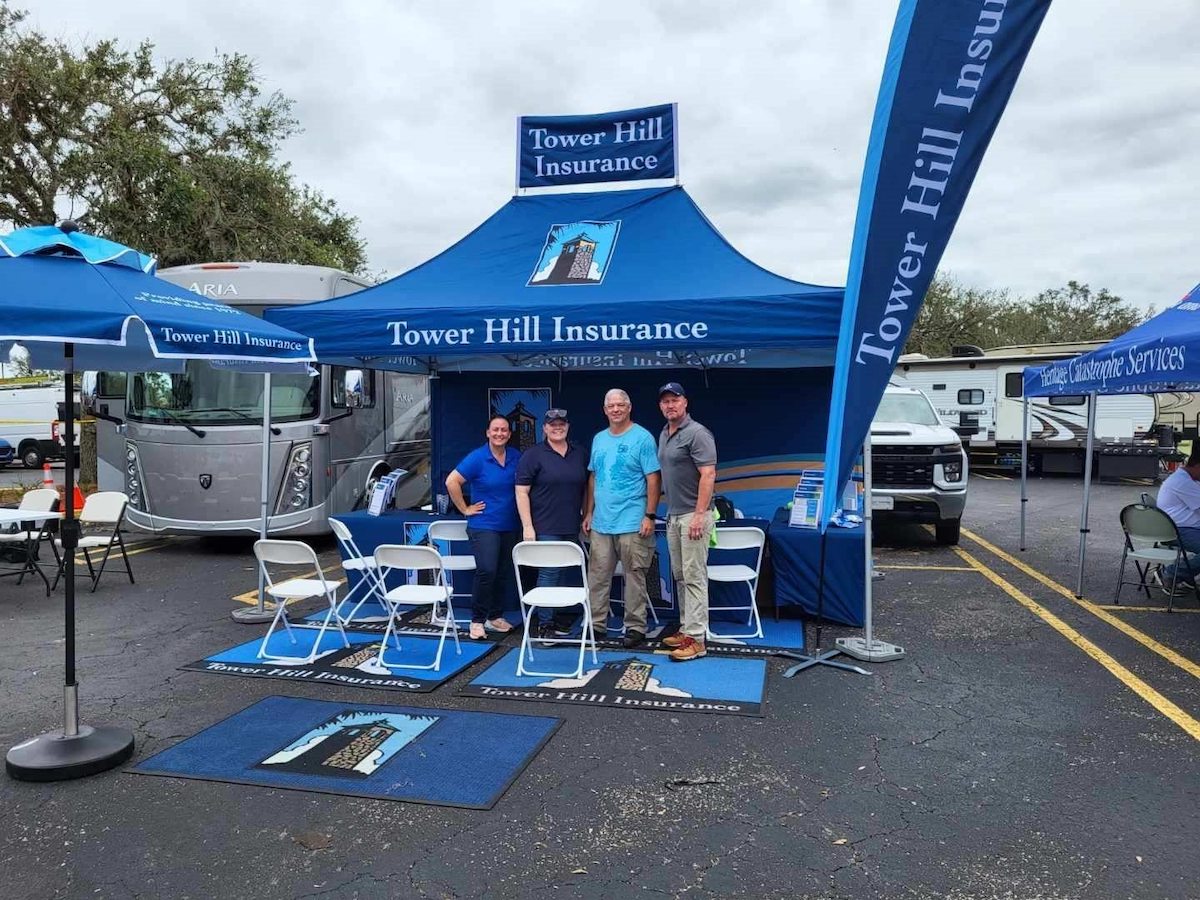 A blue pop-up tent with several tent accessories for Tower Hill Insurance Co.